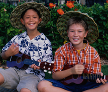 At the Ukulele Festival Hawaii in Oahu, a ukulele orchestra of students performs. // © 2012 Oahu Visitors Bureau