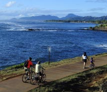 Travelers can bike and walk along Kauai’s scenic east coast, following a historic rail line. // (C) 2012 David Allio
