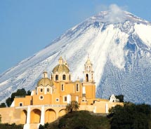 The church on top of the Great Pyramid of Cholula offers amazing views of the surrounding volcanos. // © 2012 Ministro de Turismo de Puebla