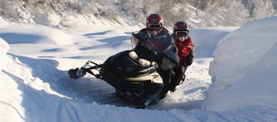 Alaska Snow Safaris offers a wide range of snowmobiling packages. // © 2012 Alaska Snow Safaris F