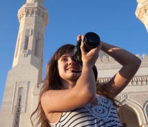 A girl takes photos at the Taj Mahal. // © 2012 Thinkstock