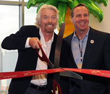 Sir Richard Branson cuts the ribbon for the inaugural flight to PSP from SFO. // © 2011 Virgin America 